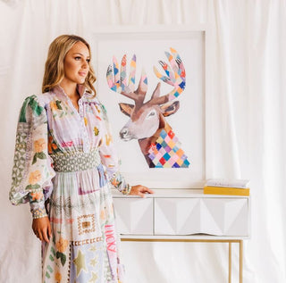Model wearing dress hire Alemais Emma Gale Print Dress in front of the Emma Gale Stag Collage