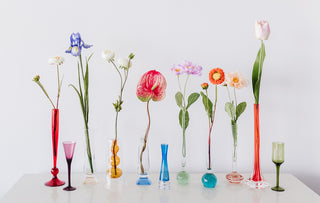 Art Glass Single Stem Vintage Vases in Various Colours lined up in a row