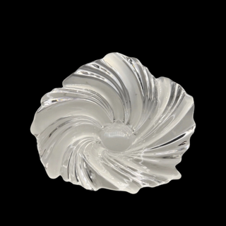 Clear and frosted glass swirl bowl on a black background
