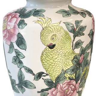 Decorative vase with a parrot and floral design on a white background